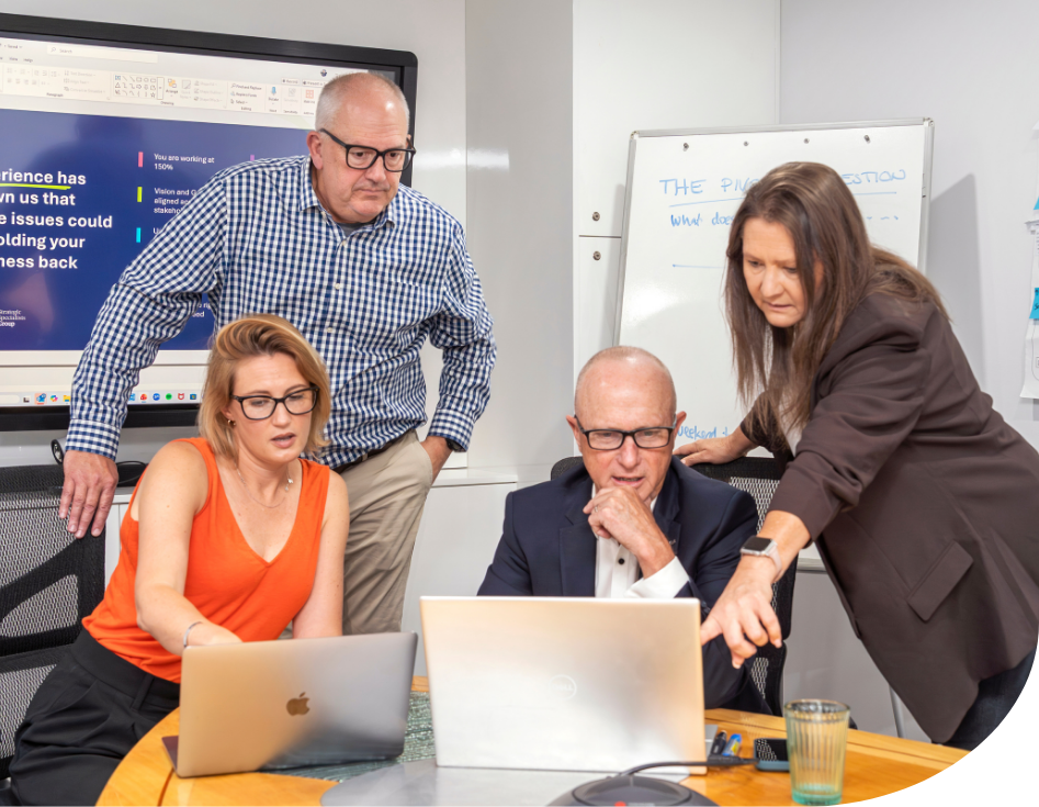 Team looking at laptop